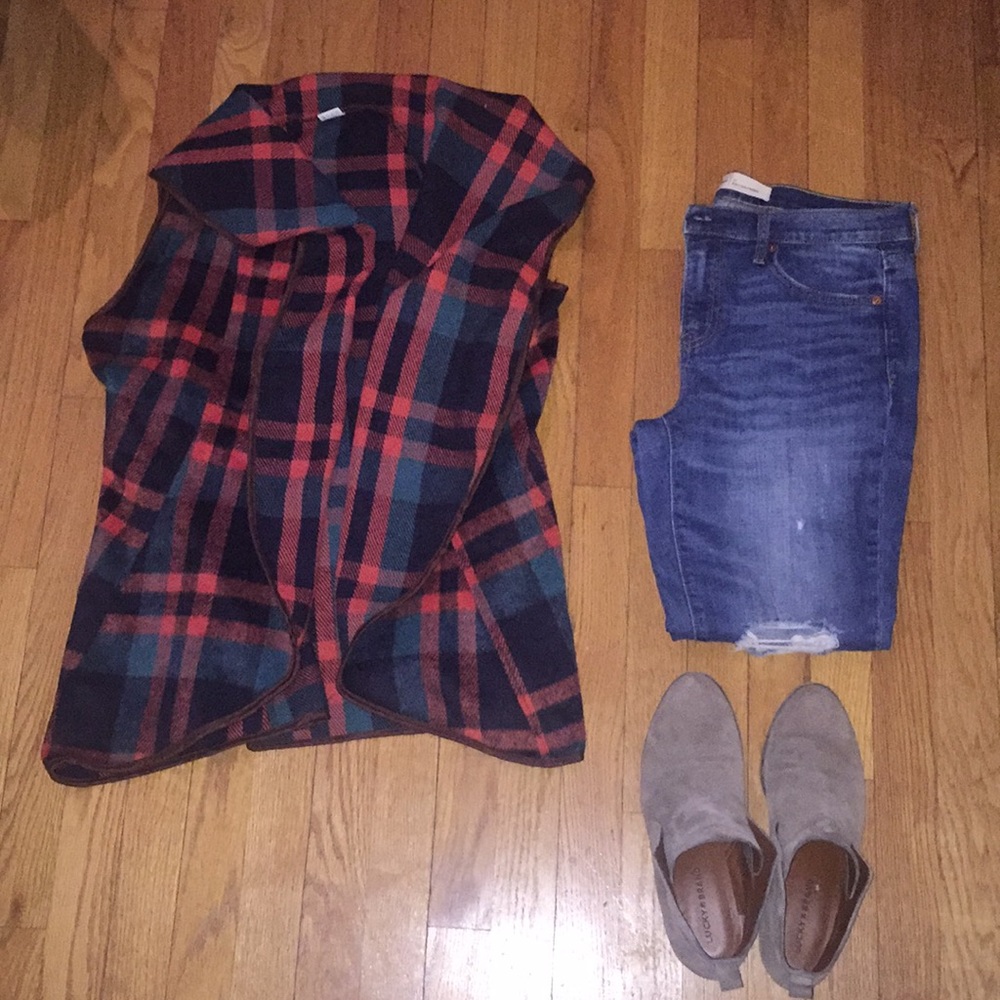 Fleece draped collared vest.